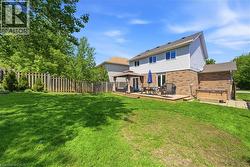 Expansive backyard with a large wooden deck featuring a gazebo -
