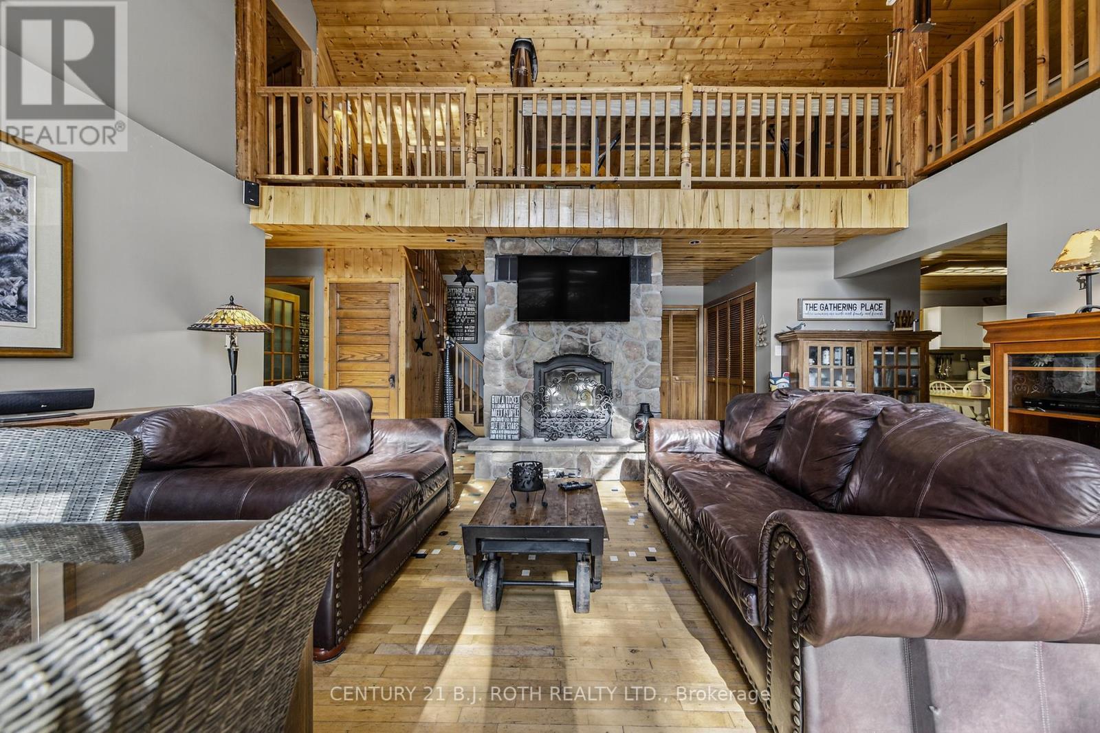 22 - 1213 Camp Jackson Road, Muskoka Lakes, ON - Indoor Photo Showing Living Room With Fireplace