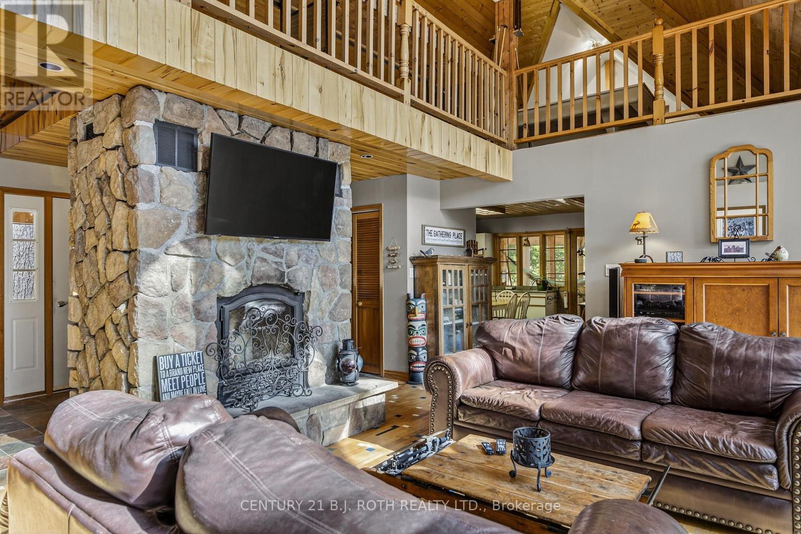 22 - 1213 Camp Jackson Road, Muskoka Lakes, ON - Indoor Photo Showing Living Room With Fireplace