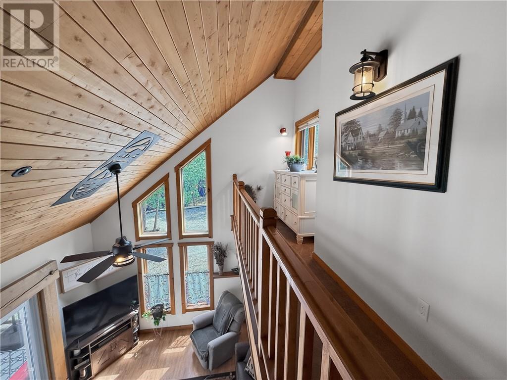 168 Fox Run Way, Mindemoya, Manitoulin Island, ON - Indoor Photo Showing Other Room With Fireplace