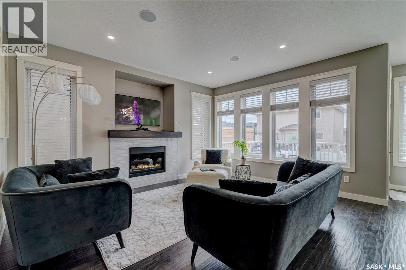 4606 Curtiss Avenue, Regina, SK - Indoor Photo Showing Living Room With Fireplace
