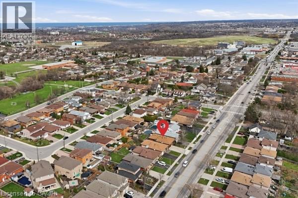 Aerial perspective showcasing a residential neighborhood with varied housing styles - 957 Stone Church Road E, Hamilton, ON - Outdoor With View