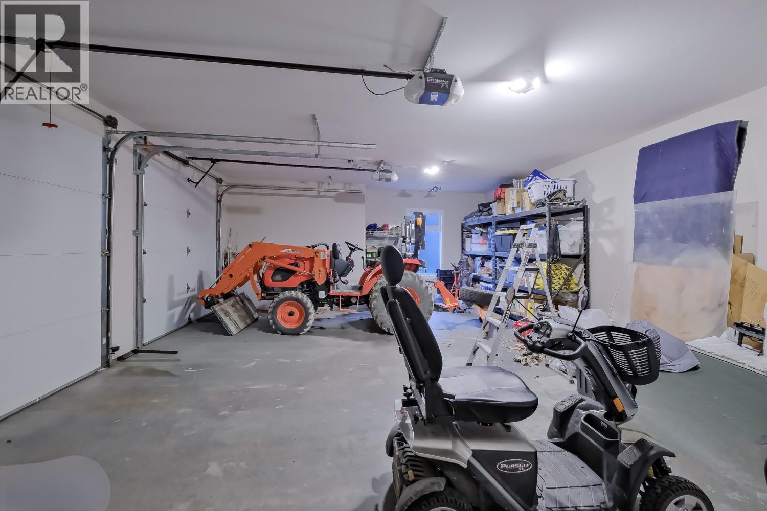 Large Double Garage - 2241 Rojem Road, Kelowna, BC - Indoor Photo Showing Garage