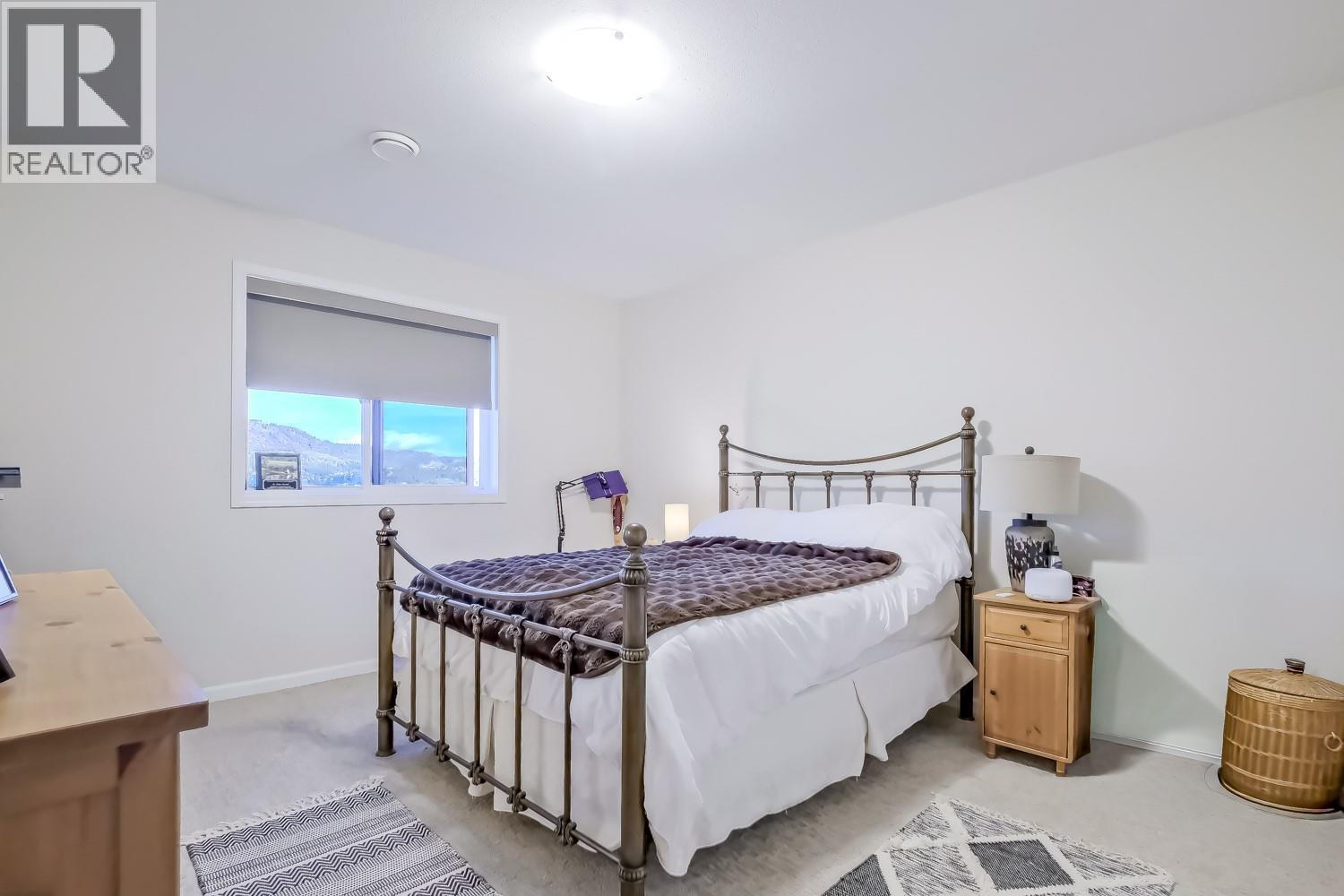 Lower Level Bedroom - 2241 Rojem Road, Kelowna, BC - Indoor Photo Showing Bedroom