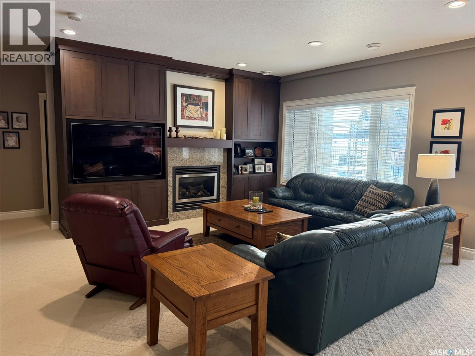 11 301 Cartwright Terrace, Saskatoon, SK - Indoor Photo Showing Living Room With Fireplace