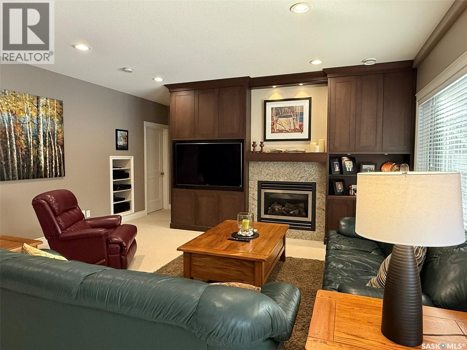 11 301 Cartwright Terrace, Saskatoon, SK - Indoor Photo Showing Living Room With Fireplace