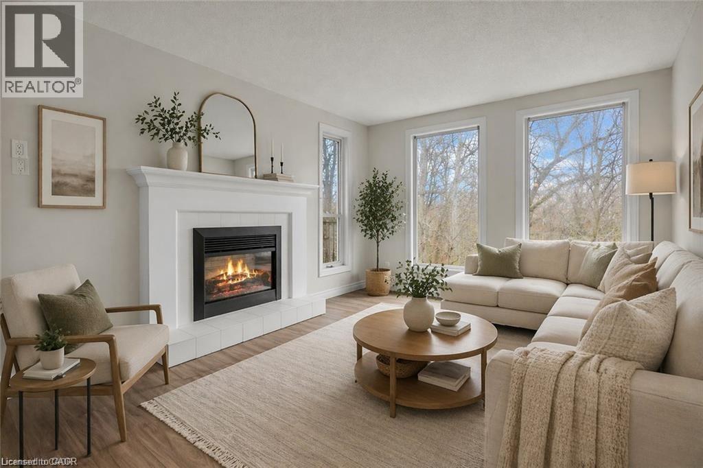 Living room - 22 Blackhorne Crescent, Kitchener, ON - Indoor Photo Showing Living Room With Fireplace