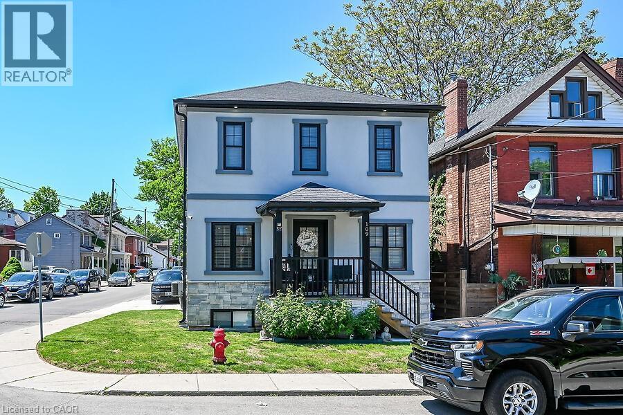 Contemporary two-story residence with a light-colored stucco exterior - 109 Ray Street N, Hamilton, ON - Outdoor With Facade