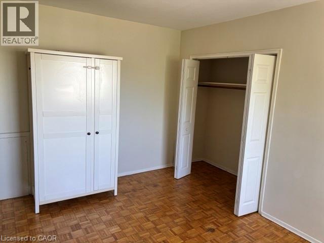 Parquet wood-finish flooring - 2205 King Street E Unit# 1, Hamilton, ON - Indoor Photo Showing Other Room