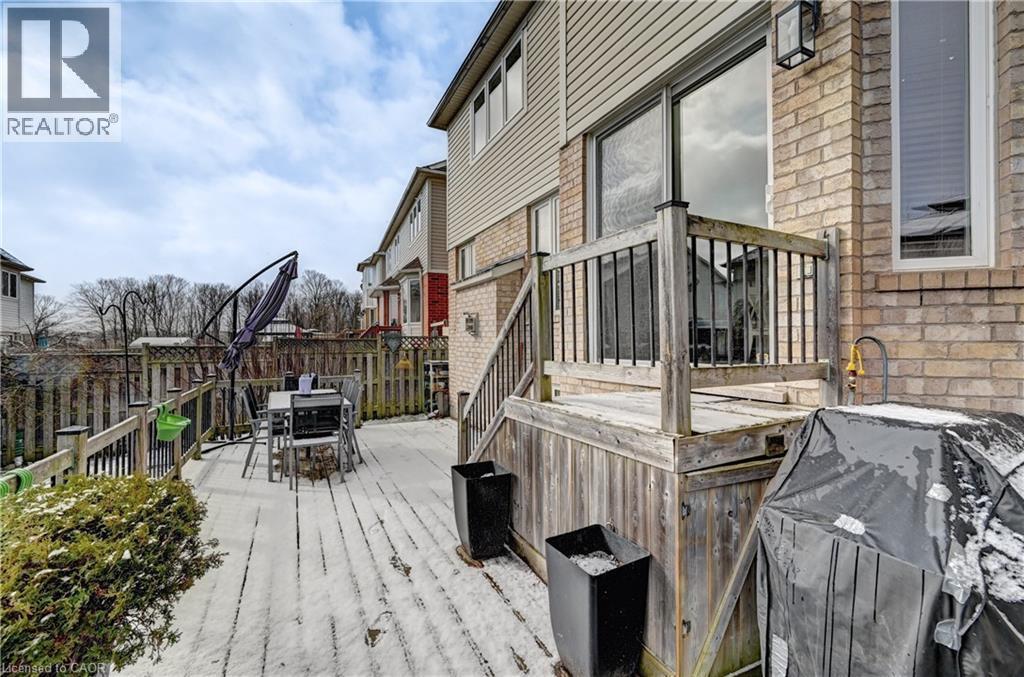 Wooden deck featuring outdoor dining space and a fenced backyard - 222 Baldwin Drive, Cambridge, ON - Outdoor With Deck Patio Veranda