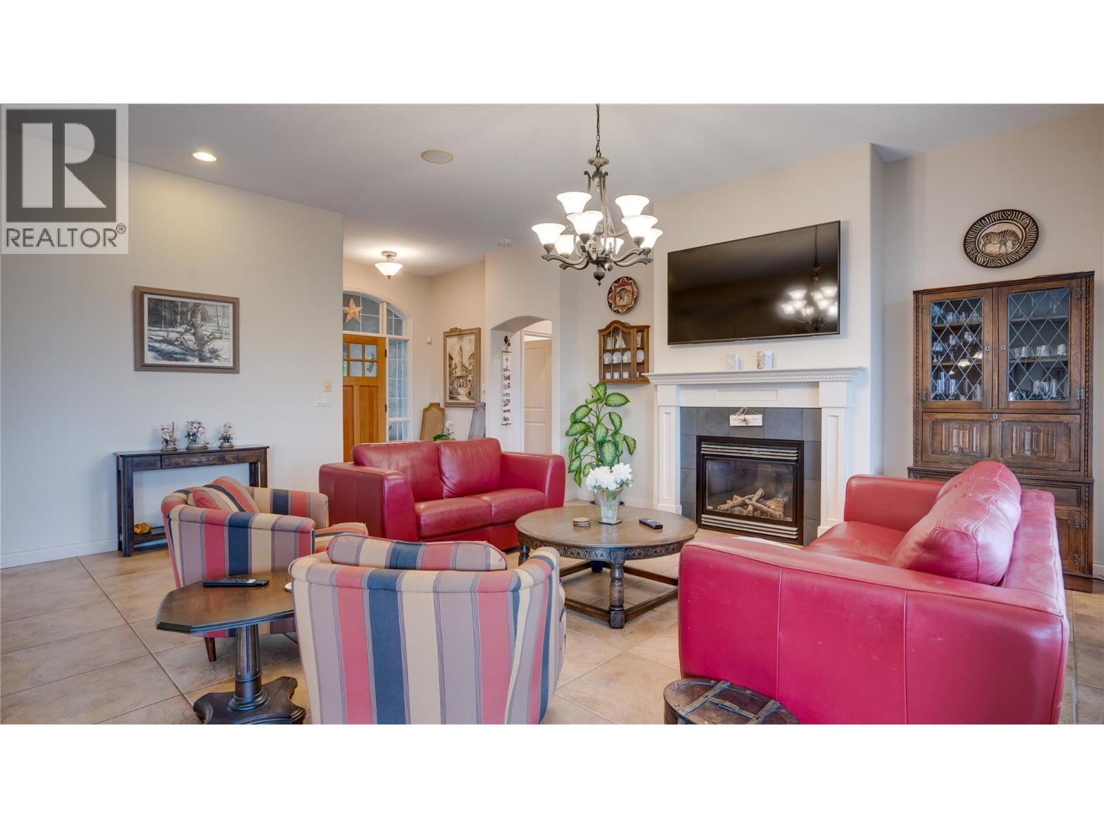 #8 Bayview Heights Lot# 8, Coldstream, BC - Indoor Photo Showing Living Room With Fireplace