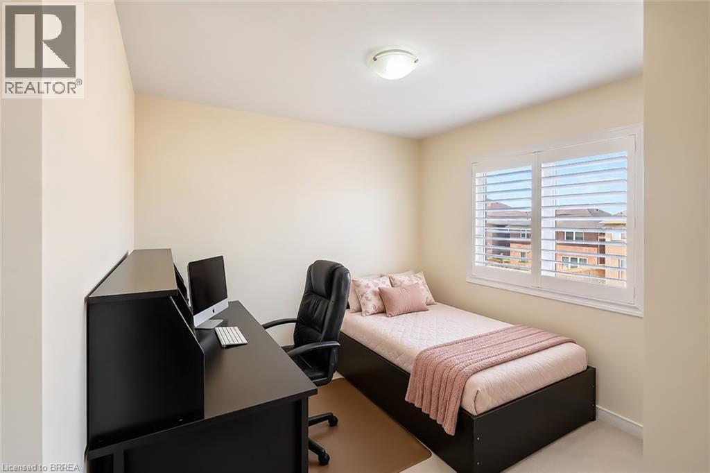Room featuring a window with white plantation shutters, neutral-toned walls, and a flush-mount ceiling light fixture - 26 Pollard Street, Brantford, ON - Indoor Photo Showing Office