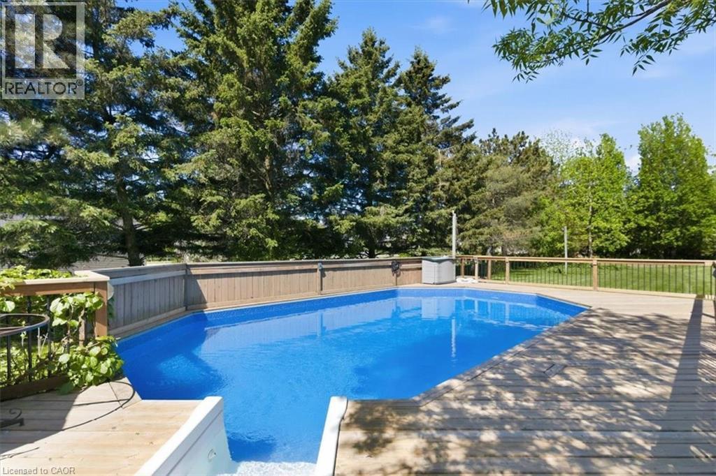 In-ground swimming pool featuring a blue liner - 26 Sideroad 18, Fergus, ON - Outdoor With In Ground Pool With Backyard