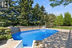 In-ground swimming pool featuring a blue liner -