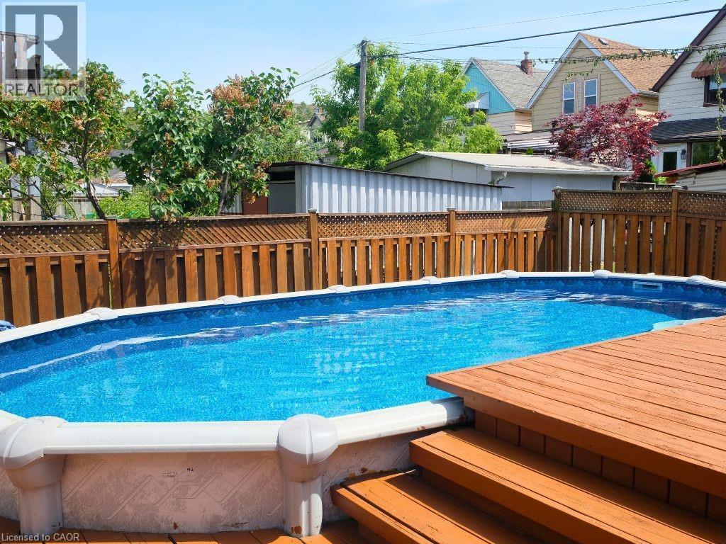 12x24 oval above-ground pool - 42 Dalhousie Avenue, Hamilton, ON - Outdoor With Above Ground Pool With Backyard