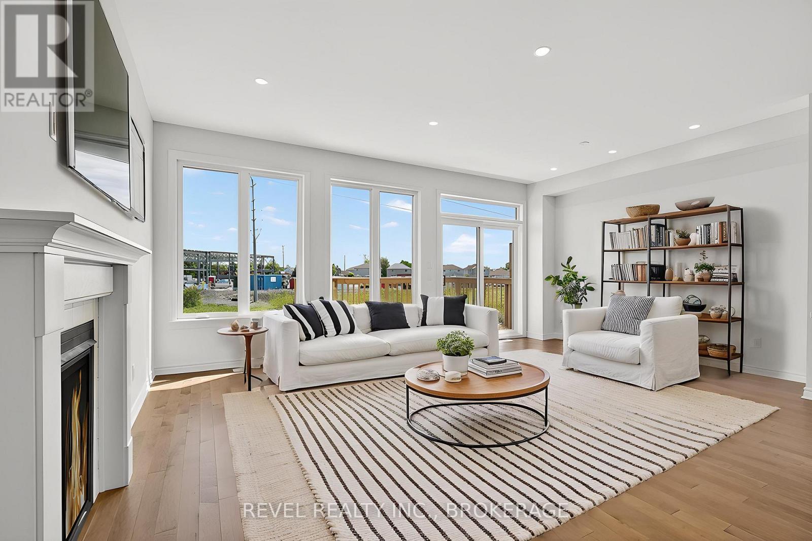 1415 Demers Avenue, Kingston (East Gardiners Rd), ON - Indoor Photo Showing Living Room With Fireplace