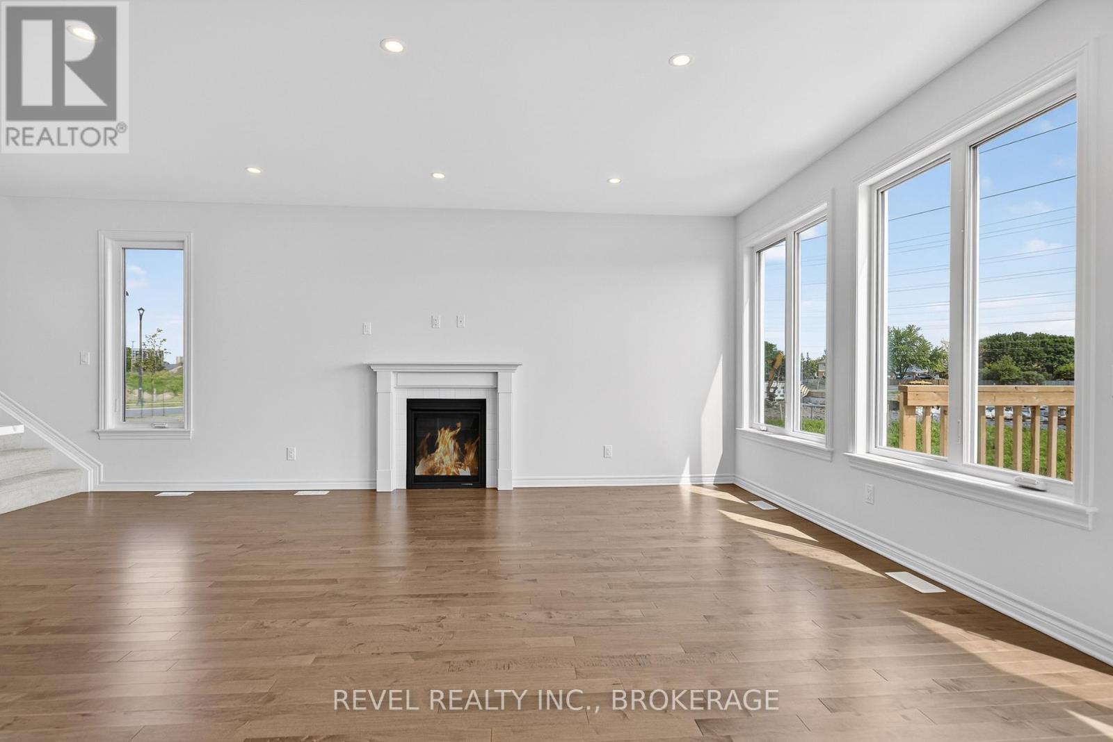 1415 Demers Avenue, Kingston (East Gardiners Rd), ON - Indoor Photo Showing Living Room With Fireplace