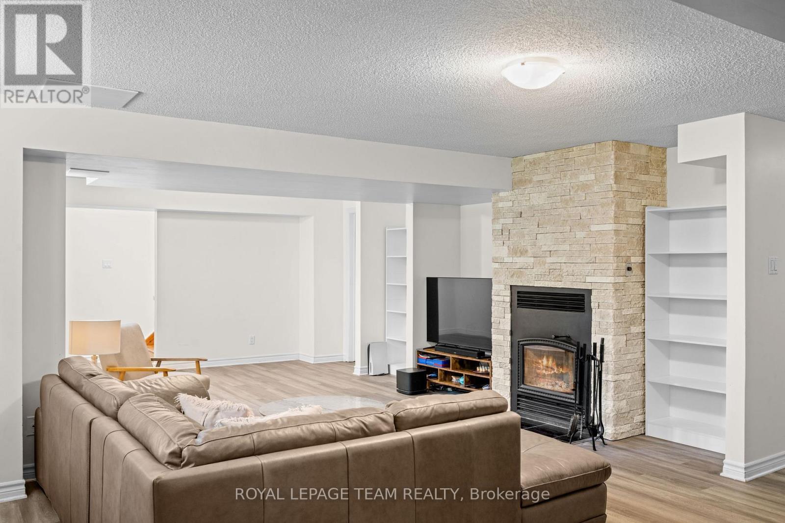 5040 Stonecrest Road, Ottawa, ON - Indoor Photo Showing Living Room With Fireplace
