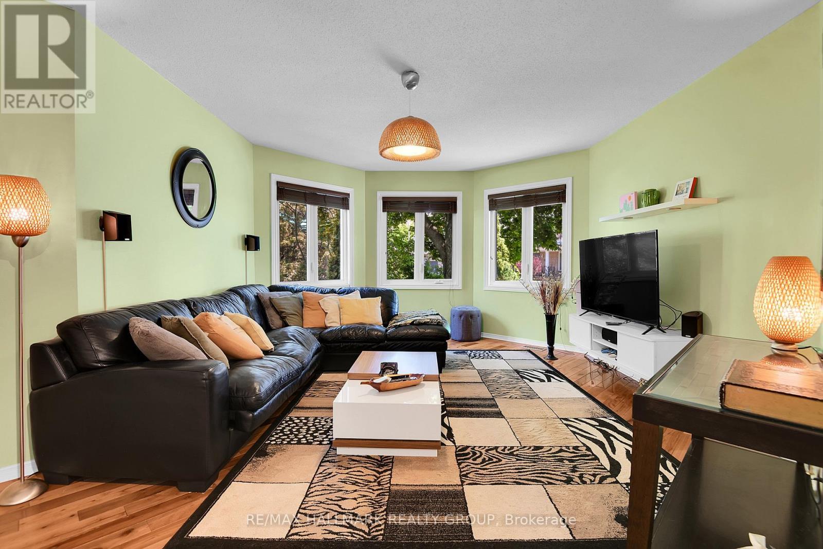 Bay wall of windows adorn living room - 22 Terrace Drive, Ottawa, ON