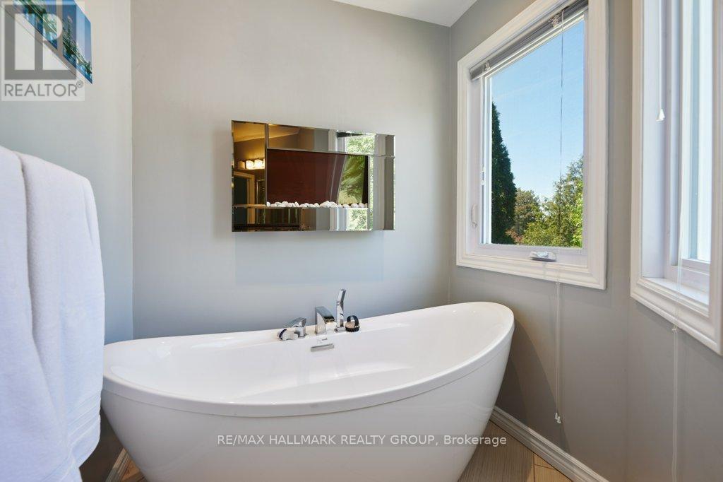 Romantic tub with accent fireplace - 22 Terrace Drive, Ottawa, ON