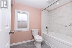 Main bathroom on upper floor - tiled tub -