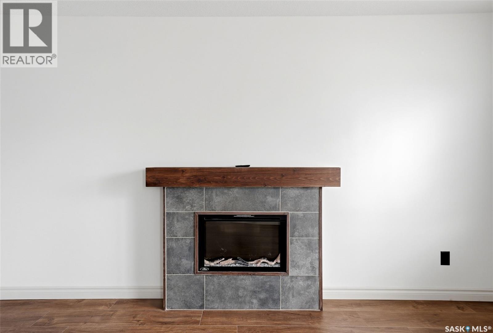 4348 Shaffer Street, Regina, SK - Indoor Photo Showing Other Room With Fireplace
