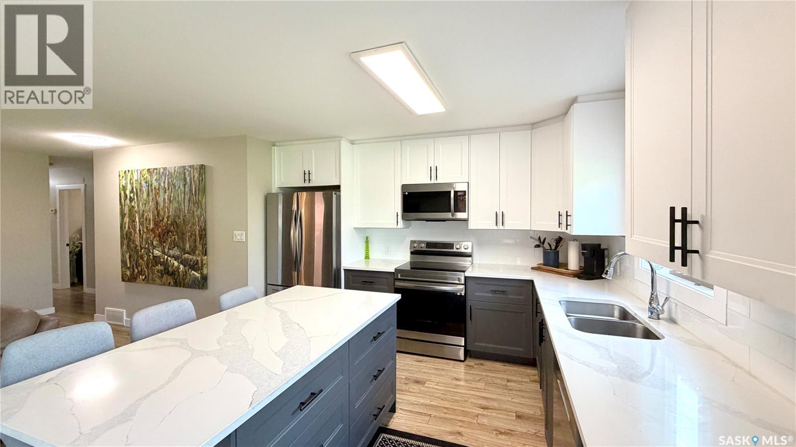 205 Ruby Drive, Coteau Rm No. 255, SK - Indoor Photo Showing Kitchen With Stainless Steel Kitchen With Double Sink