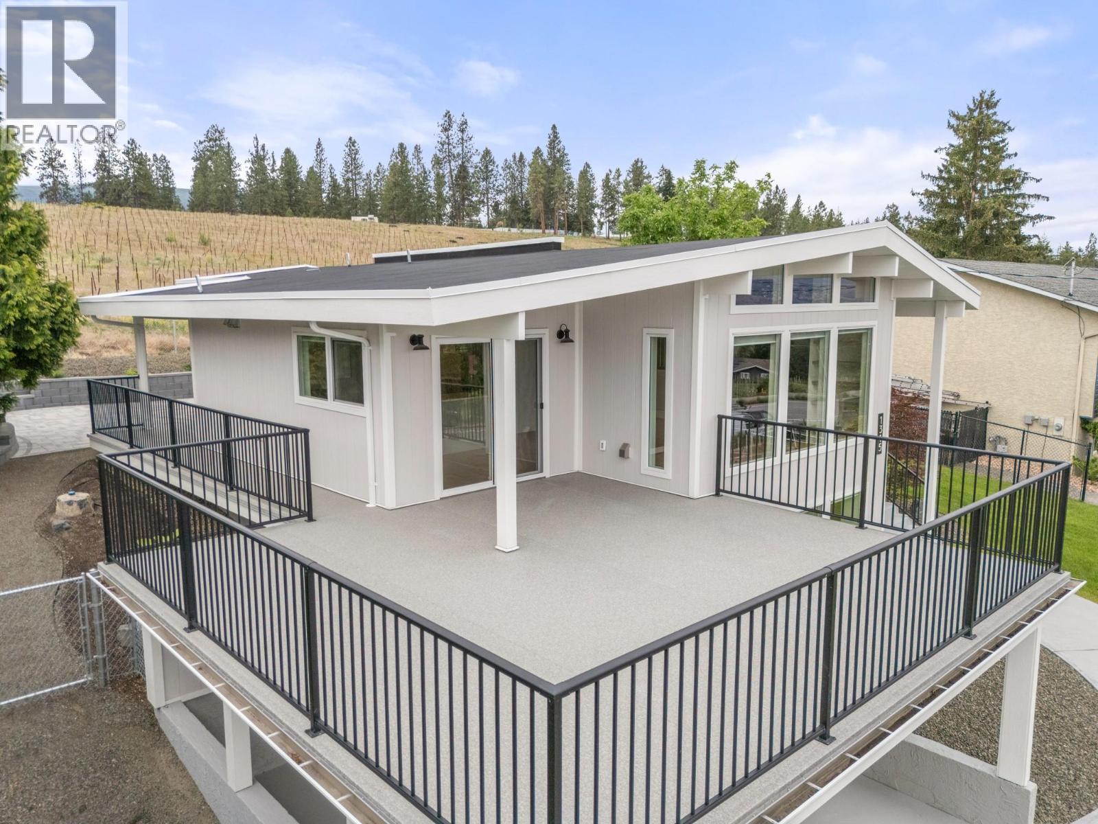 Beautifully renovated inside and out! Enjoy the lake views from the expansive upper deck - 1315 Dehart Road, Kelowna, BC