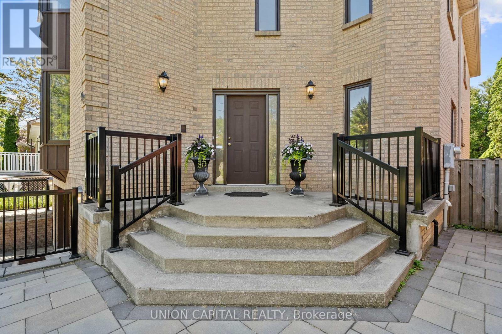 Grand front entry with elevated porch - 99 Abitibi Avenue, Toronto, ON