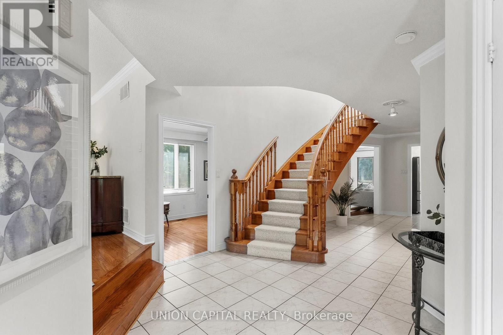 Classic oak staircase with a timeless stair runner - 99 Abitibi Avenue, Toronto, ON