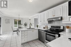 Sunlit eat-in kitchen with garden views -