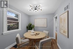 Dining room (virtually staged). -
