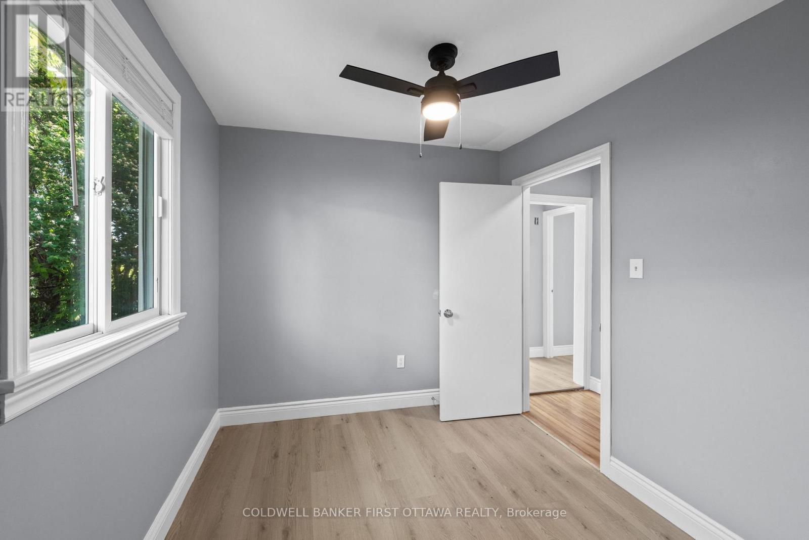 Includes ceiling fan & bright side window. - 1246 Kitchener Avenue, Ottawa, ON