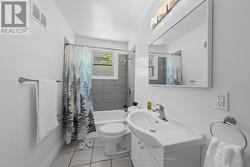 Full 4 pc bathroom w privacy window in shower. -