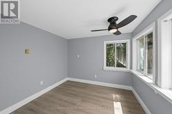 Back leftcorner bedroom w wall to wall windows. -
