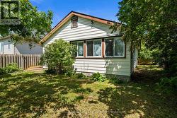 Both back bedrooms w view into the backyard. -