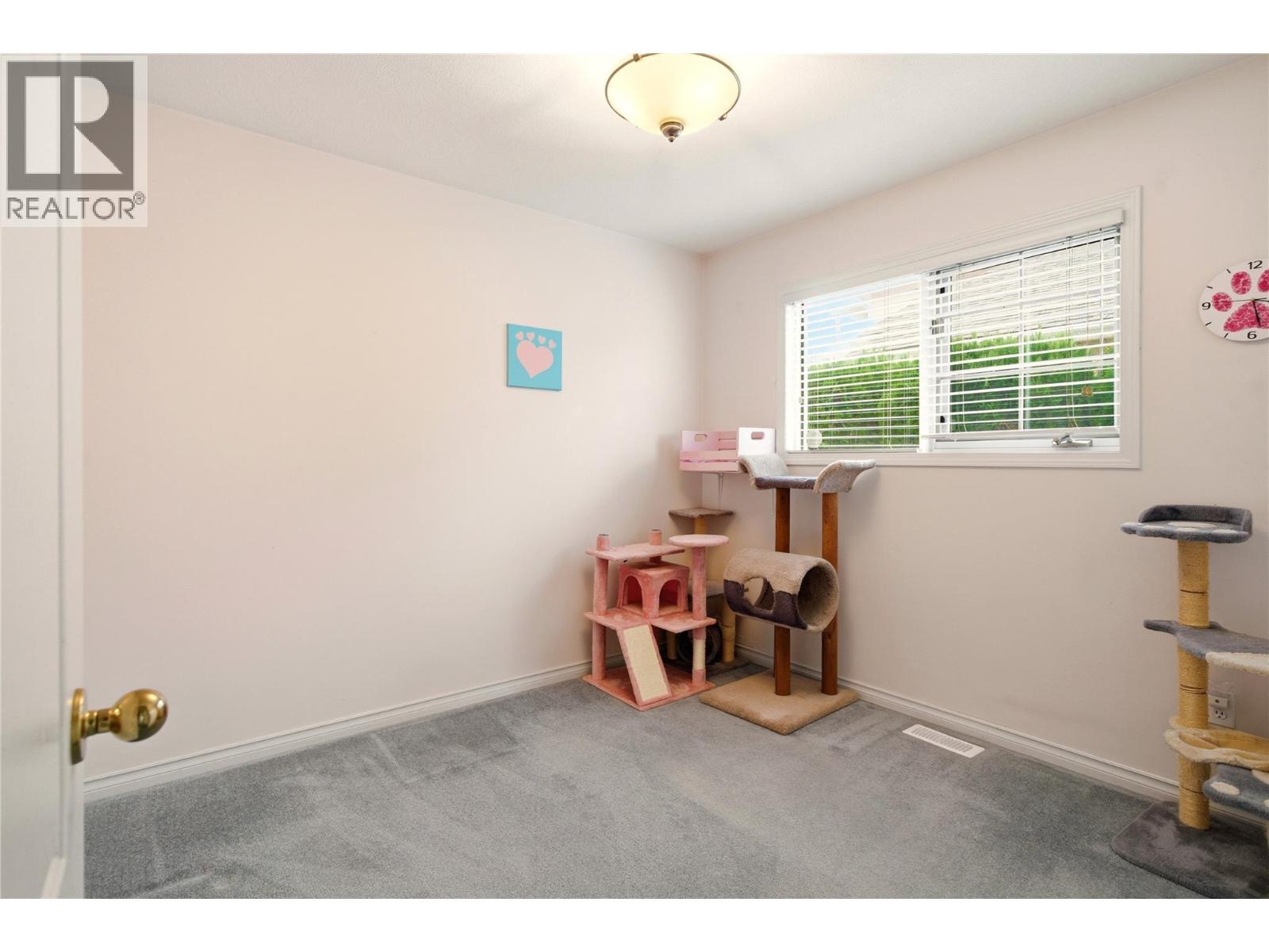 Main floor bedroom - 756 Springrose Way, Kelowna, BC