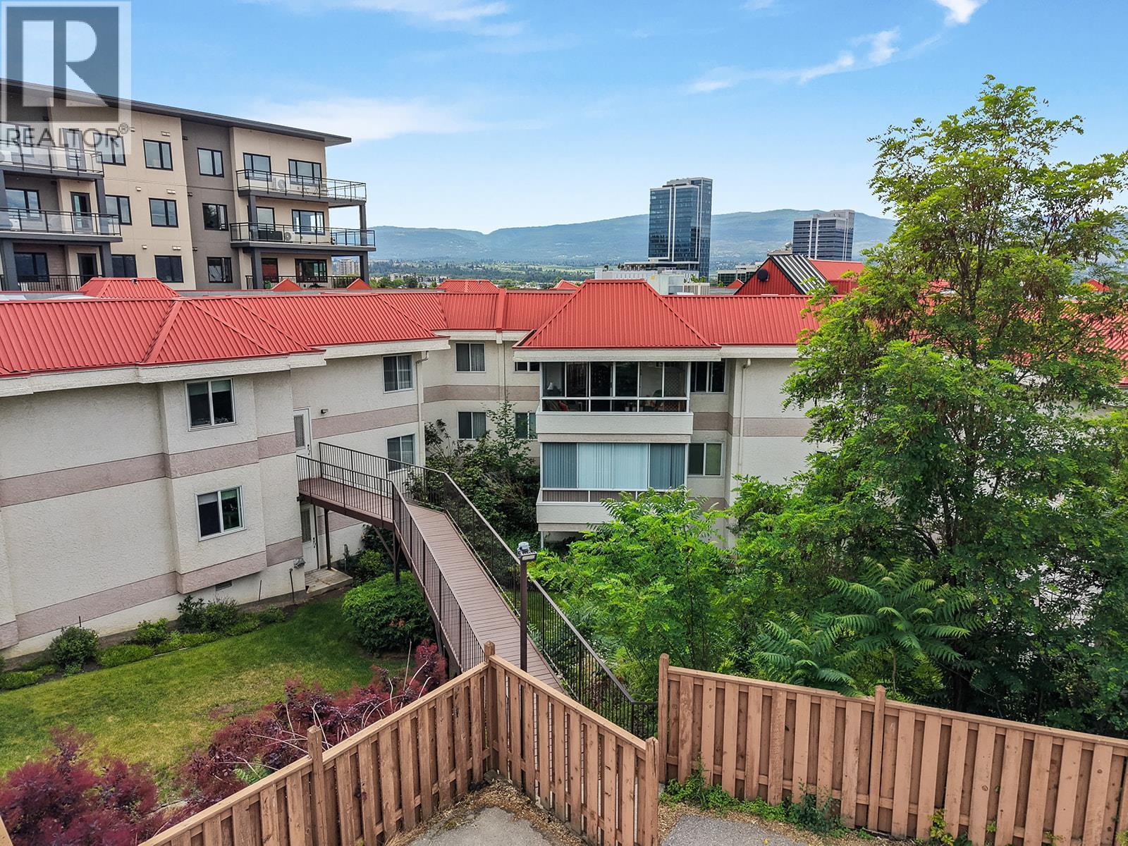 Backyard green area fenced in. - 1534 Lawrence Avenue Unit# 304, Kelowna, BC - Outdoor
