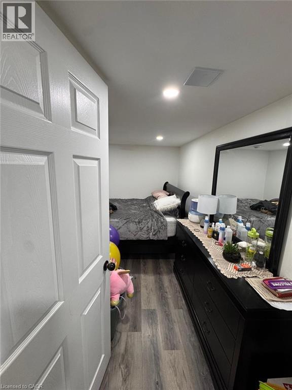 Interior room featuring wood-finish flooring and recessed ceiling lighting - 1377 Coronation Drive, London, ON - Indoor
