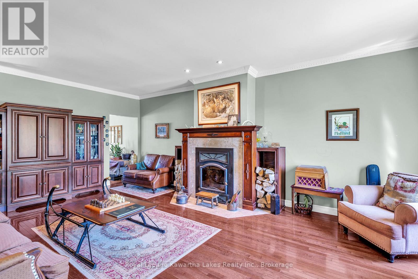 Living Room with Fireplace - 2435 Elm Tree Road, Kawartha Lakes (Fenelon), ON