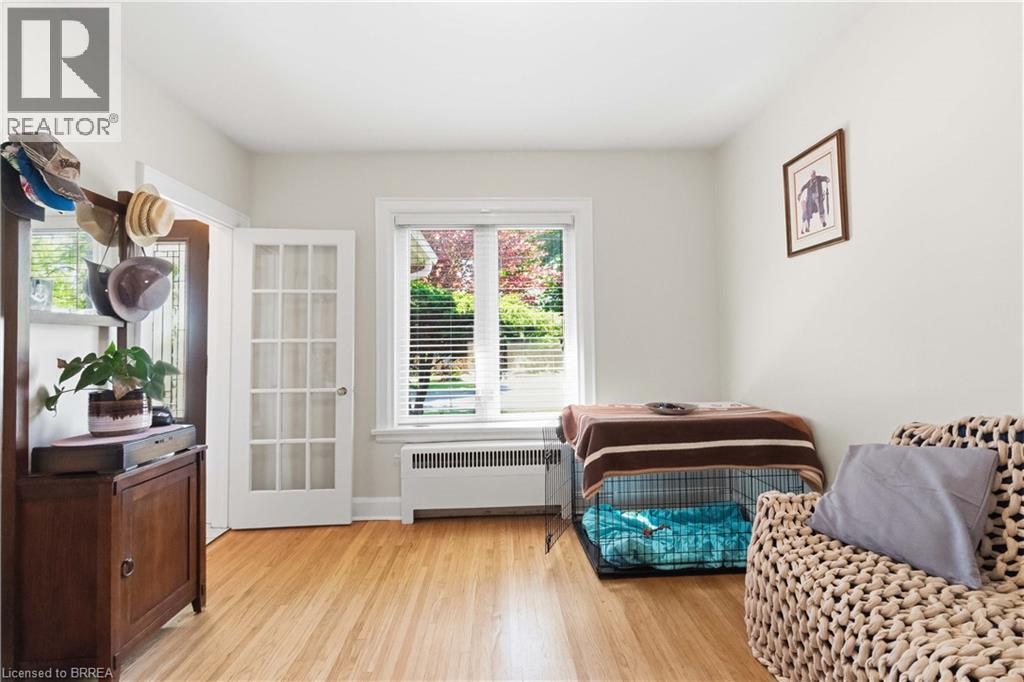 Hardwood flooring throughout a room with white painted walls - 134 Queensway Drive, Brantford, ON