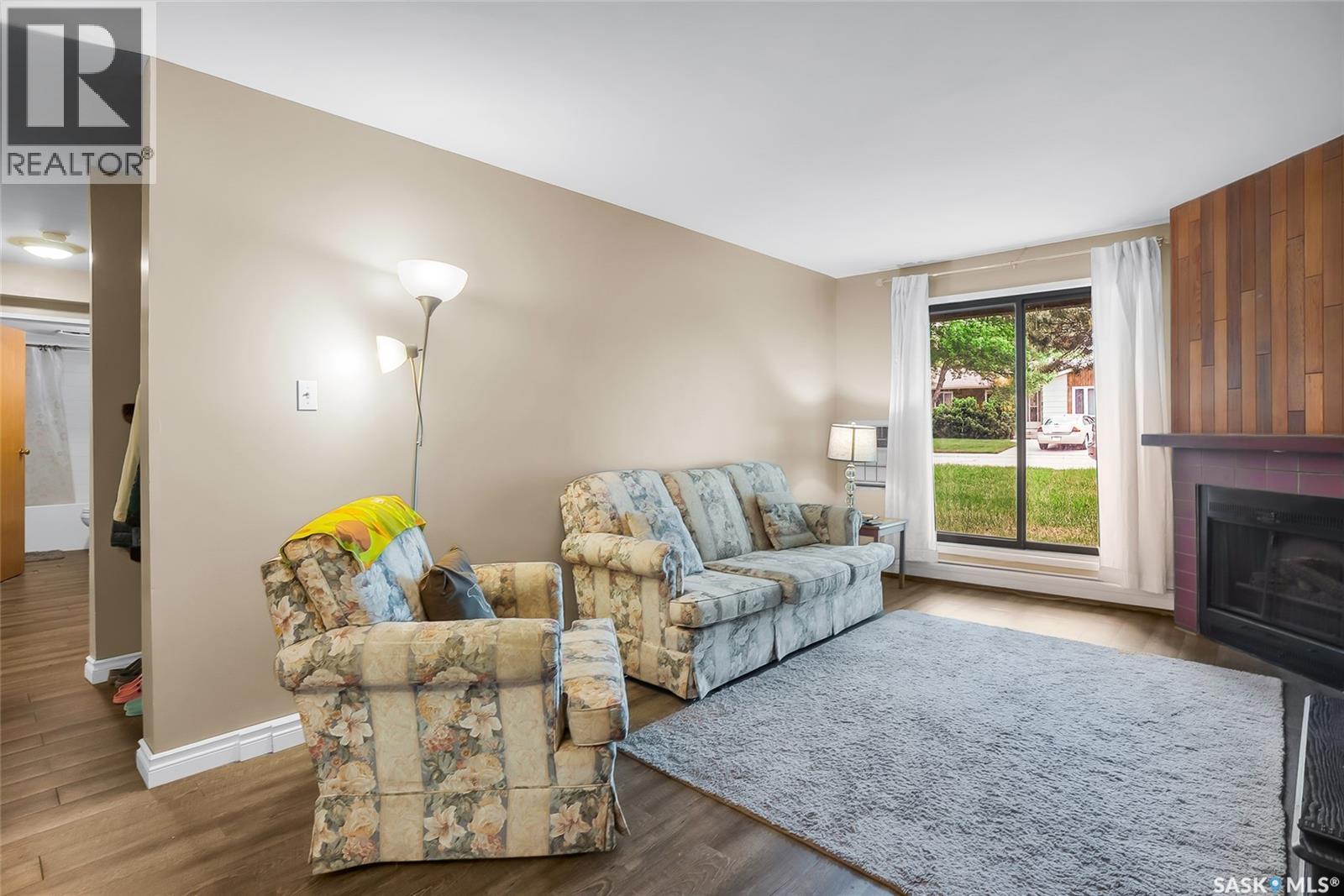 612 310 Stillwater Drive, Saskatoon, SK - Indoor Photo Showing Living Room With Fireplace