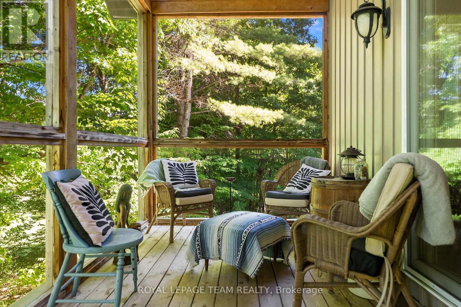 A frame screened in porch - 1622 Concession 4B, Lanark Highlands, ON - Outdoor With Deck Patio Veranda
