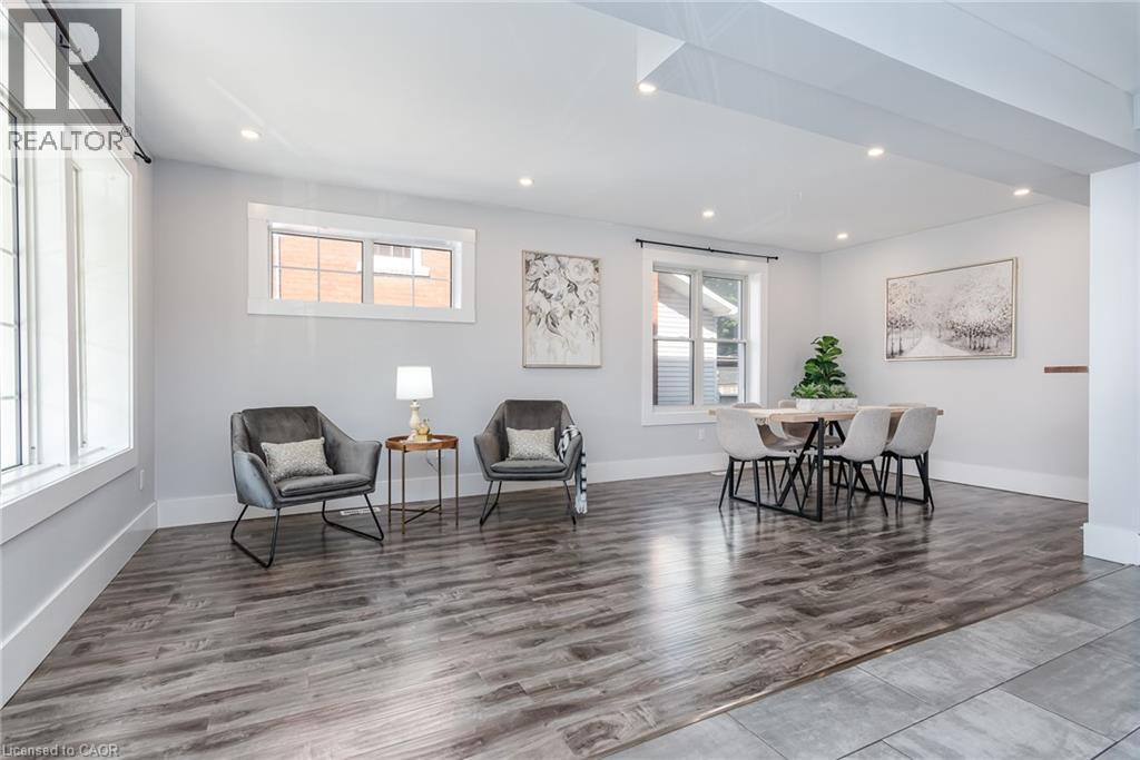 Open-concept living space with recessed lighting and wood-finish flooring - 40 Woodland Avenue, Kitchener, ON