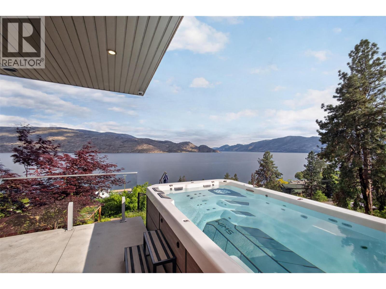 The property also features a premium, partially recessed Bullfrog Spas S150 swim spa valued at over $50,000. This thing is huge and works incredible, you don't need a pool with this. - 5835 Vicary Road, Peachland, BC
