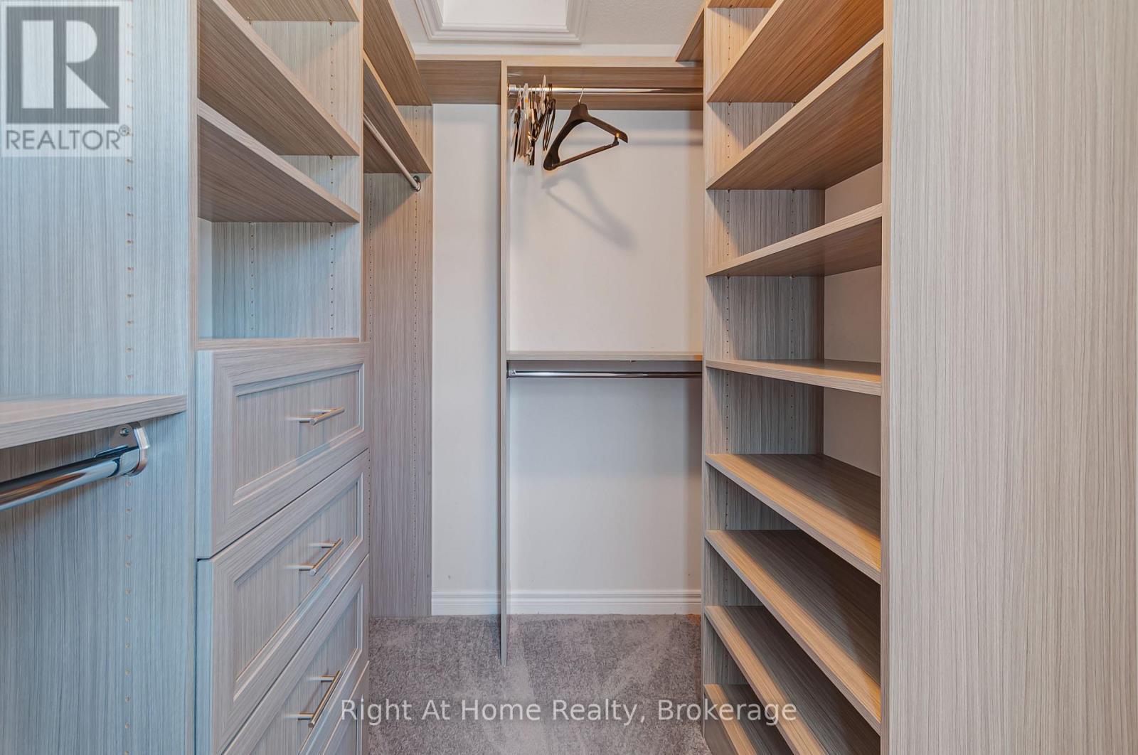 Large walk-in closet with custom built-in wardrobe - 9 Callon Drive, Hamilton (Meadowlands), ON