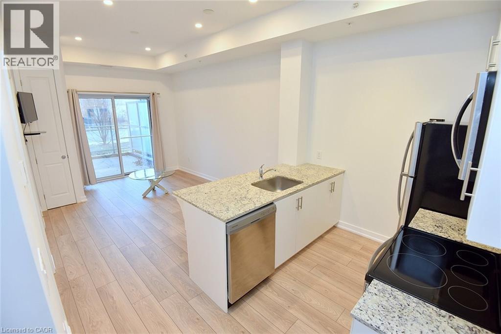 Kitchen with granite countertops, stainless steel sink, and integrated dishwasher - 4040 Upper Middle Road Unit# 105, Burlington, ON