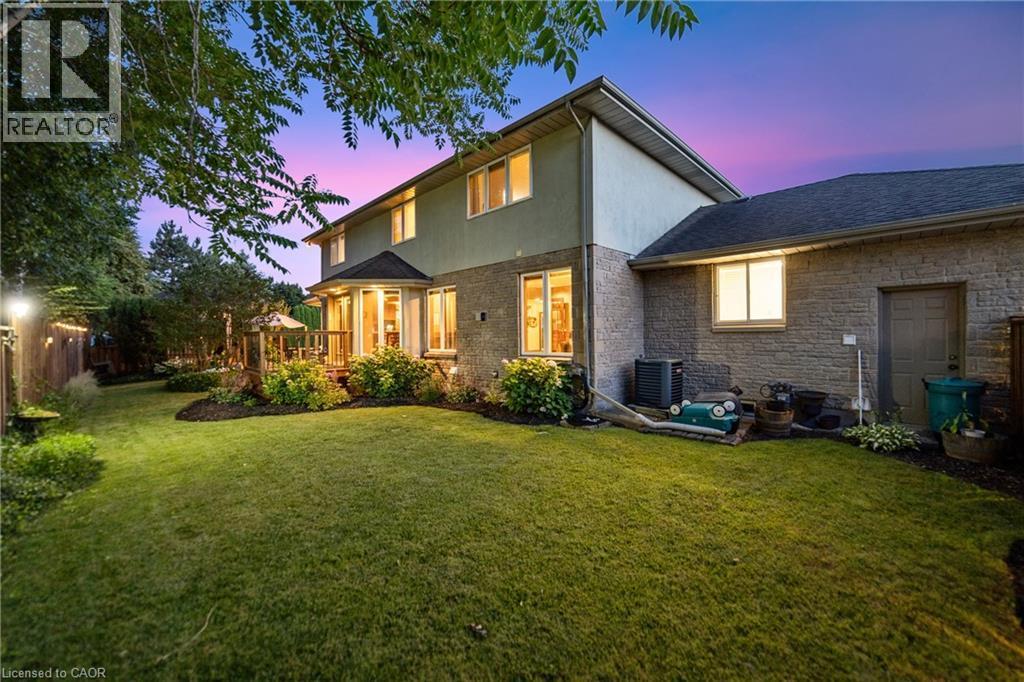 Expansive backyard featuring a manicured lawn, established landscaping with an irrigation system - 7775 St. Augustine Crescent, Niagara Falls, ON