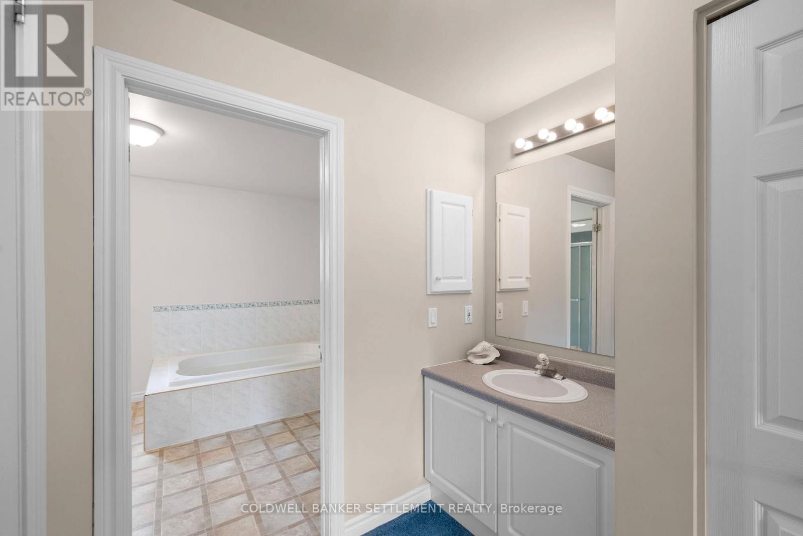 Primary ensuite - extra sink/vanity in hall - 42 Berry Park Lane, Rideau Lakes, ON