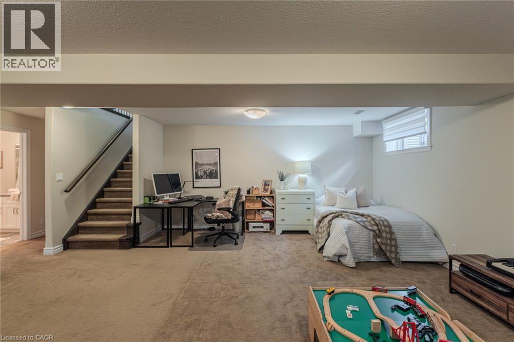 Carpeted lower level with a window, recessed ceiling lighting, and a neutral wall color - 15 Winterberry Lane, Waterford, ON